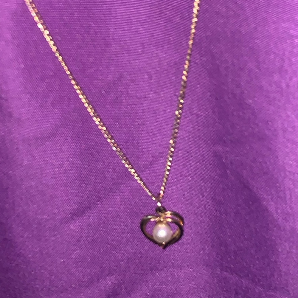 Gold necklace and heart pendant